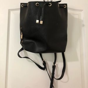 Textured Leather Purse Backpack from Barney’s